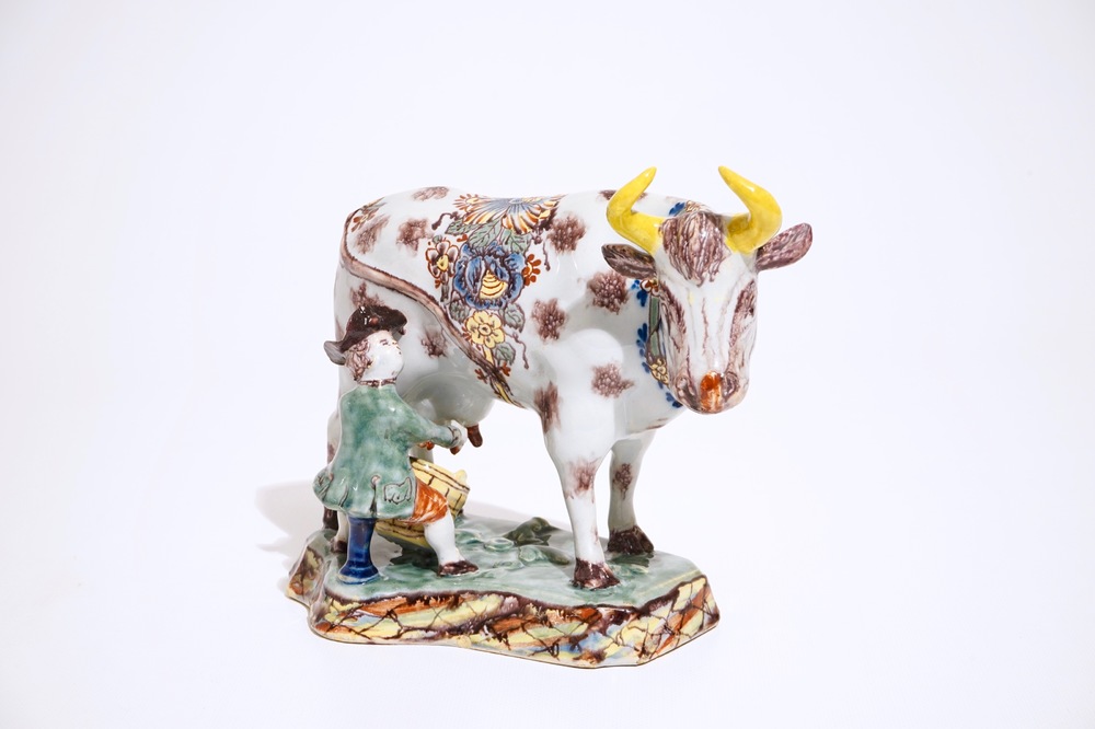 A polychrome Dutch Delft cow milking group, 18th C.