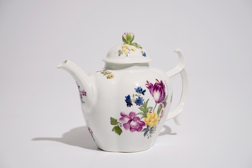 A German porcelain teapot and cover with floral design, 18/19th C.