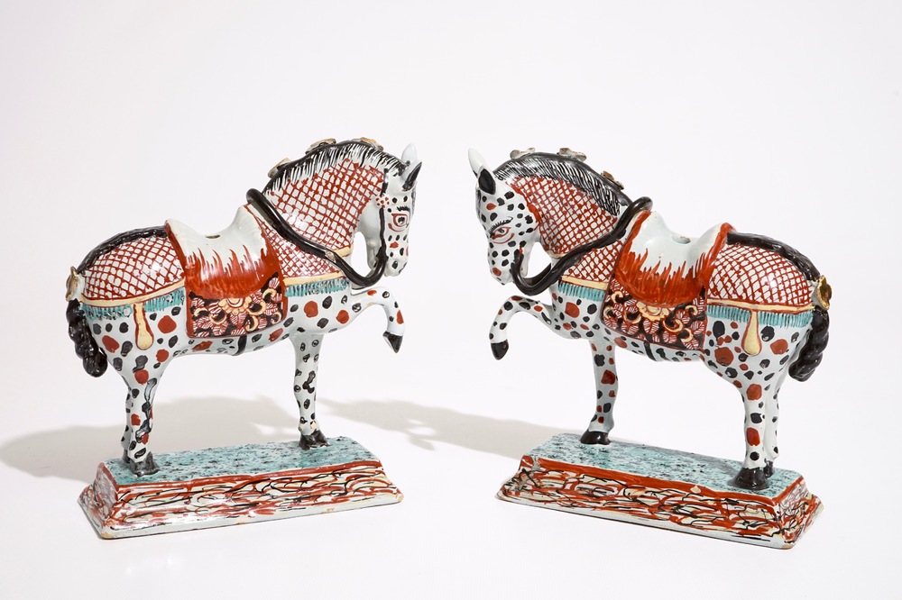 A pair of Dutch Delft polychrome petit feu models of horses, 18th C.
