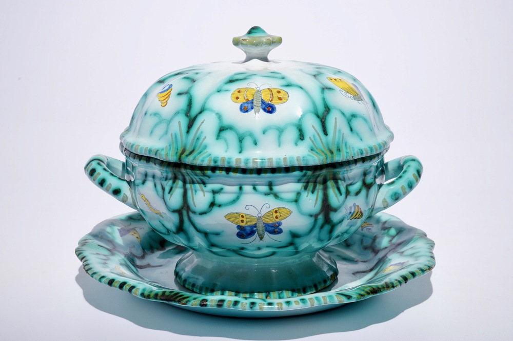 A Brussels faience tureen and cover on stand with butterflies and caterpillars, 18th C.