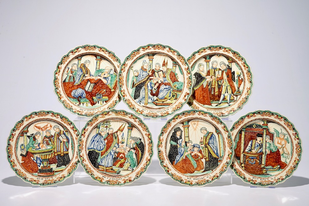 Een complete reeks van zeven in Nederland beschilderde creamware &quot;Sacramenten&quot; borden, 18e eeuw