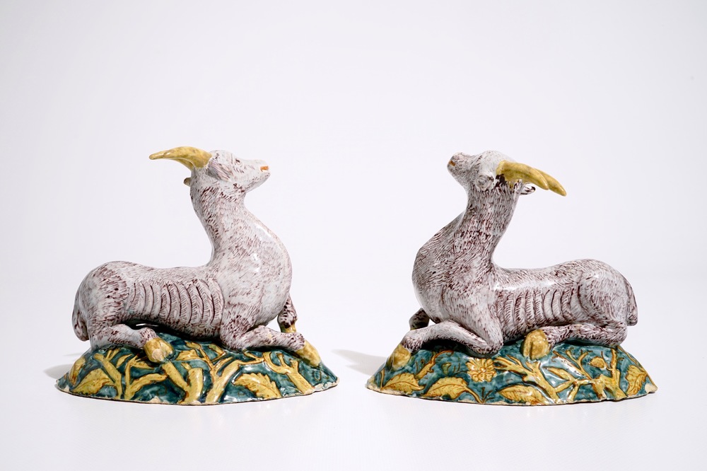 A pair of large Dutch Delft polychrome models of goats on a ground, 18th C.