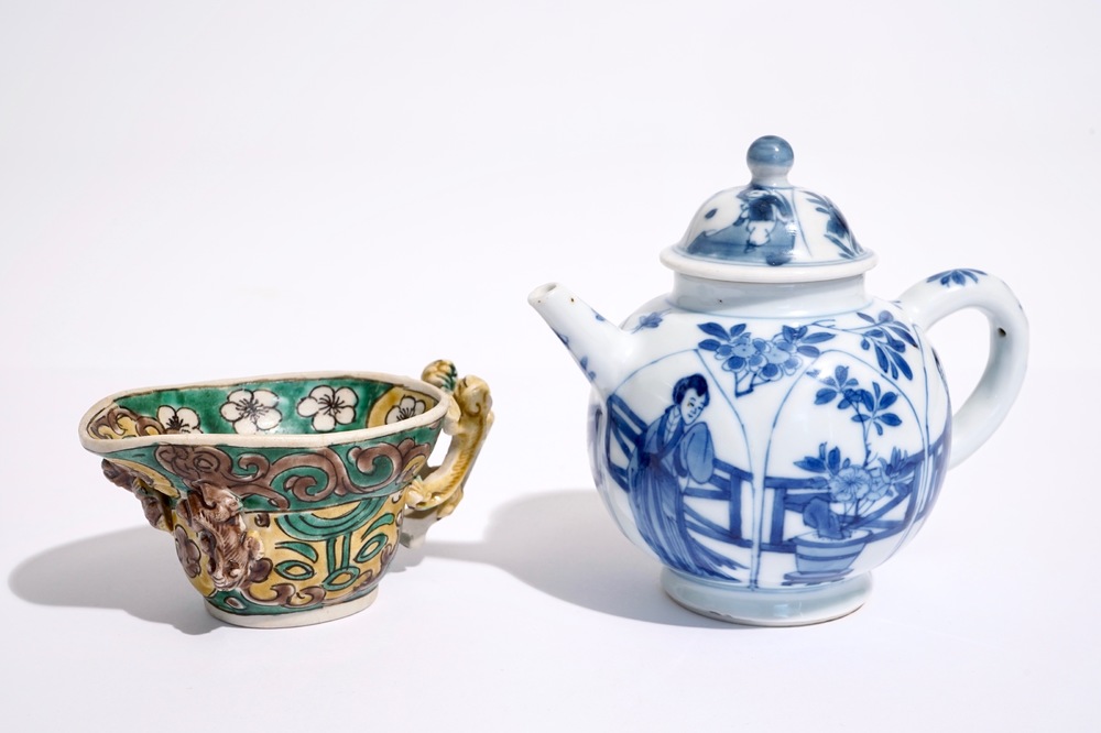 A blue and white Chinese teapot and cover and a verte biscuit libation cup, Kangxi