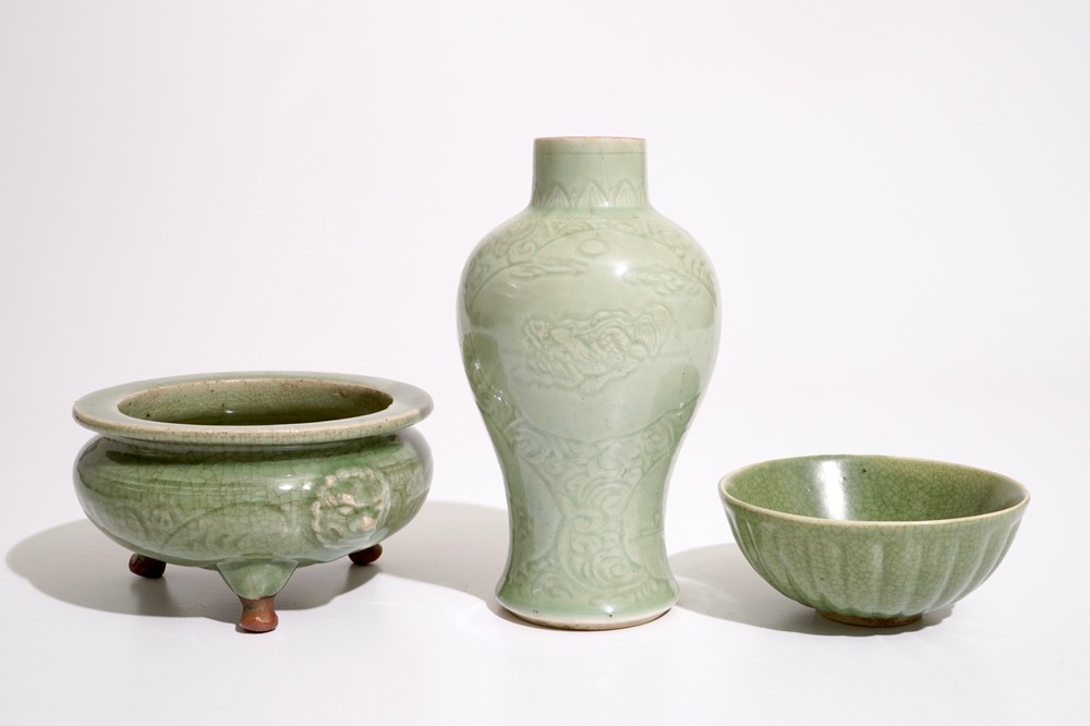 A Chinese Longquan celadon tripod censer, an underglaze-decorated vase and a bowl, Ming and later