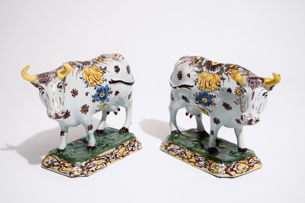 A pair of large polychrome Dutch Delft models of cows, 18th C.