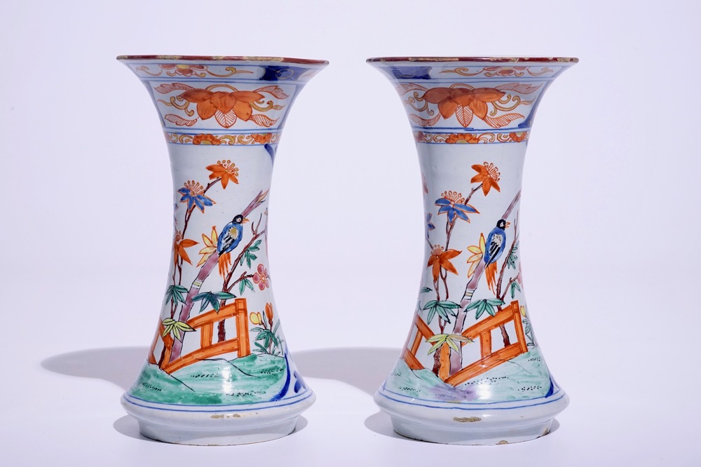 A pair of Dutch Delft polychrome petit feu Kakiemon-style vases, 18th C.