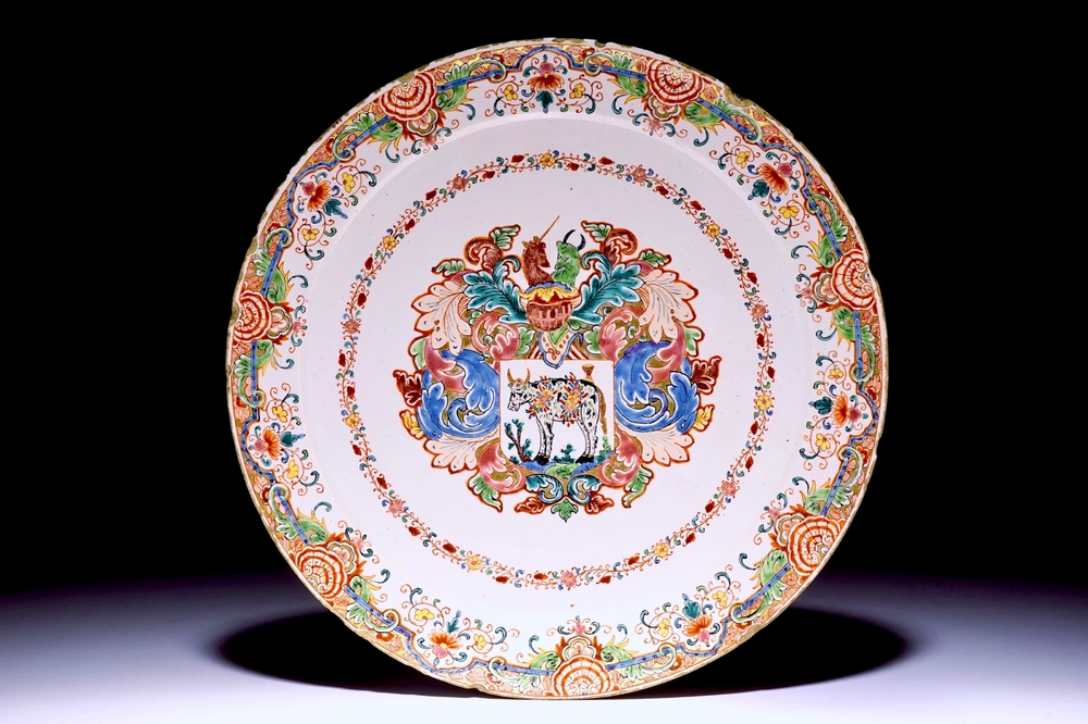 A Dutch Delft polychrome petit feu armorial plate with a prize-winning cow, 18th C.