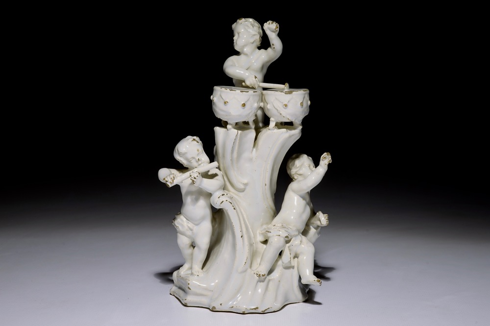 A white Delft group of putti playing music, probably German, 18th C.