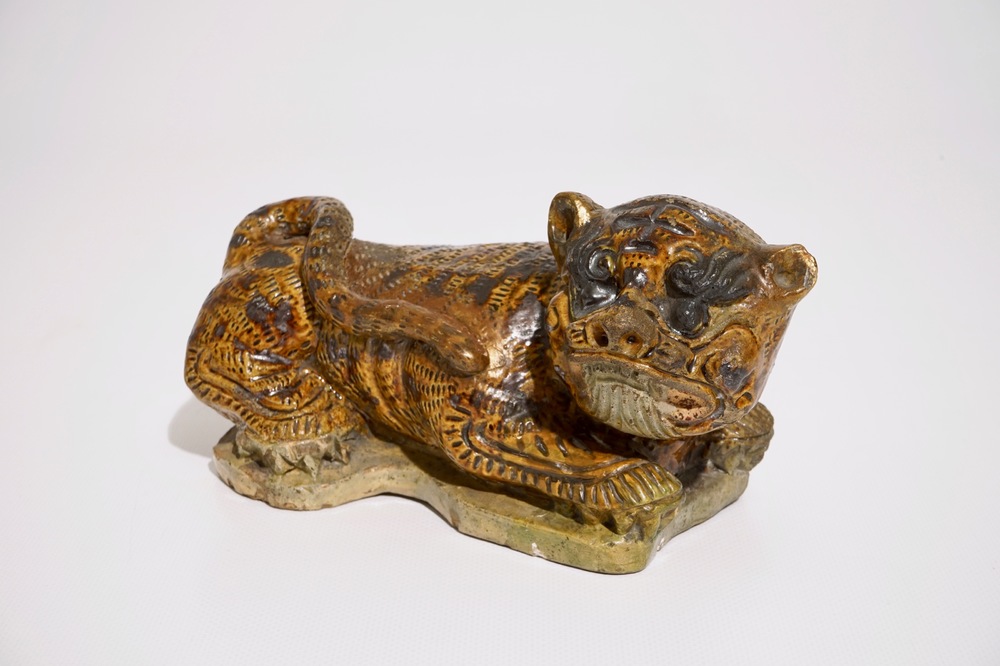 A Chinese glazed stoneware model of a tiger, probably Ming