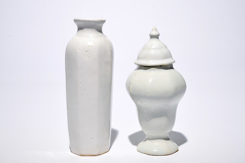 A white Dutch Delft rouleau vase and a vase with cover, 17/18th C.
