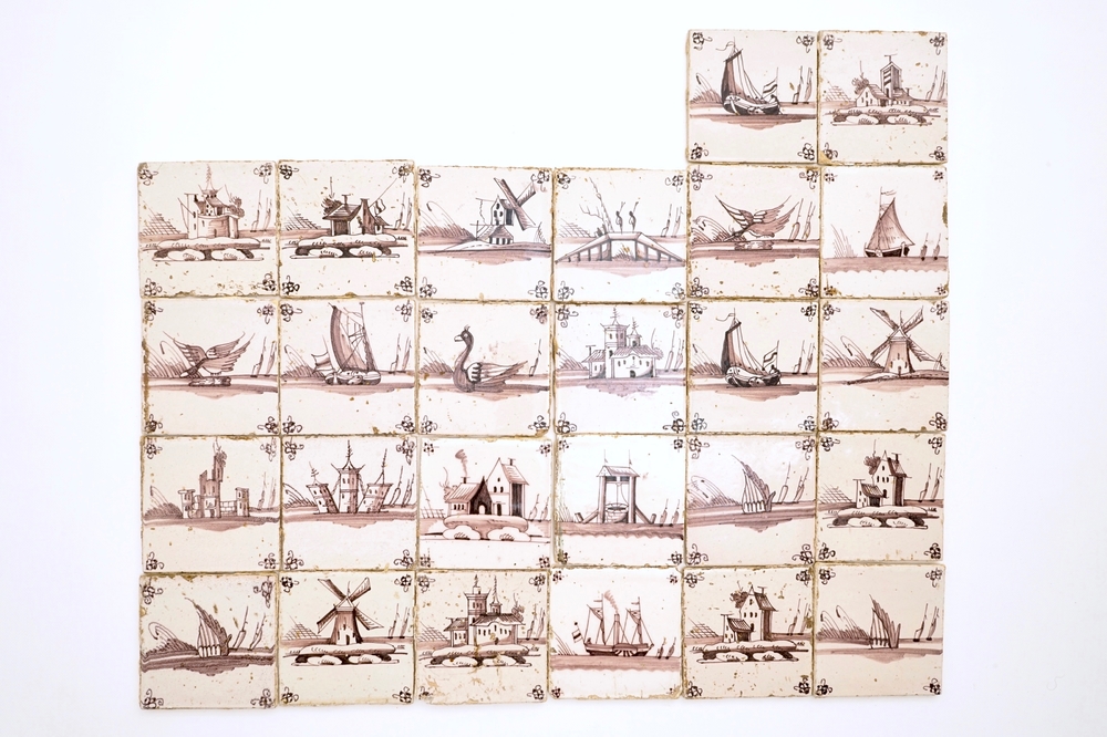 A set of 26 manganese Dutch Delft landscape tiles, 18/19th C.