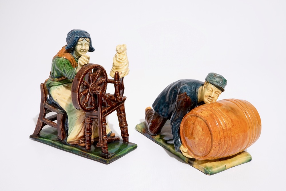 Two Flemish pottery figures of a lace maker and a barrel pusher, prob. Laigneil workshop, 20th C.