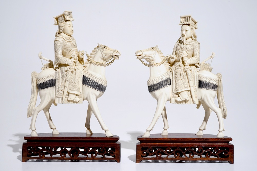 A pair of Chinese ivory warriors on horseback on wooden bases, 19th C.