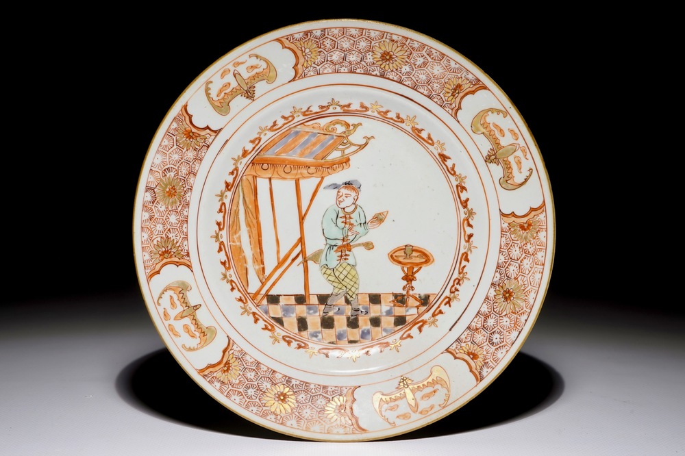 A Chinese famille verte &quot;South Sea Bubble&quot; plate with a Commedia Dell'Arte figure, Kangxi