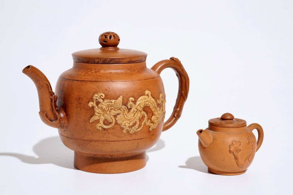 Two Chinese Yixing teapots with relief design, Kangxi and later