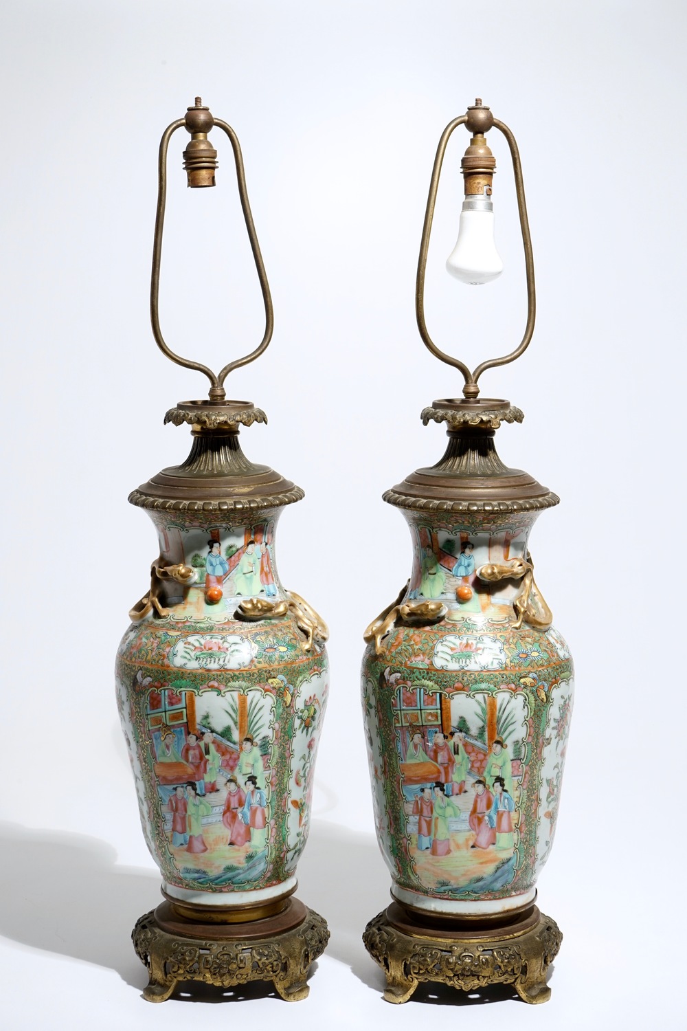 A pair of bronze-mounted Chinese Canton famille rose vases, transformed into lamps, 19th C.