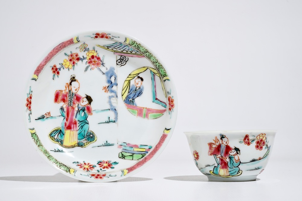 A Chinese famille rose cup and saucer with figures in a garden, Yongzheng