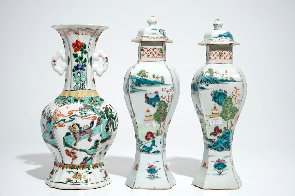 A Chinese famille verte vase with animals, Kangxi, with a pair of famille rose vases and covers, Qianlong