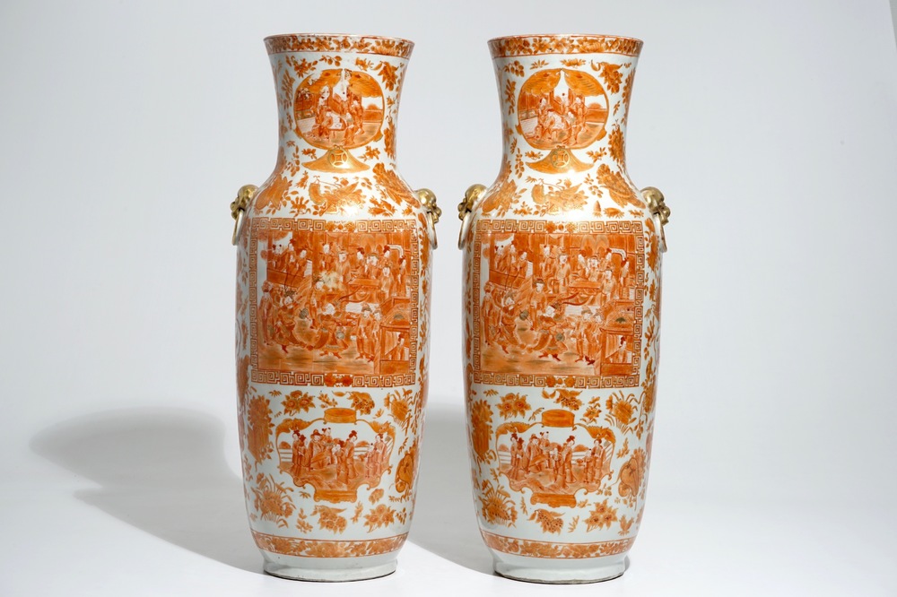 A pair of tall Chinese iron red and gilt vases, 19th C.