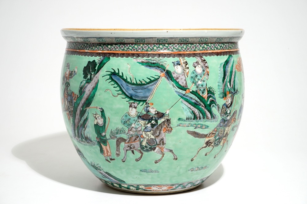 A Chinese famille verte green-ground fish bowl with warriors on horseback, 19th C.