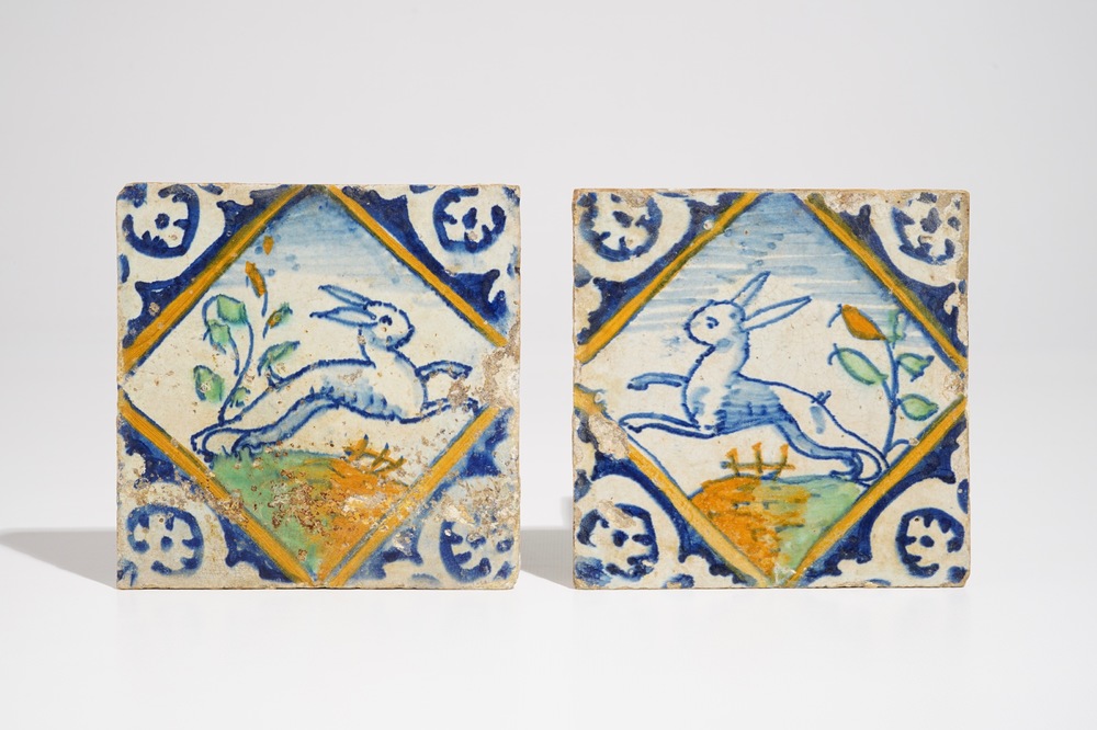 A pair of Dutch Delft mirror-decorated diamond tiles with hares, ca. 1600