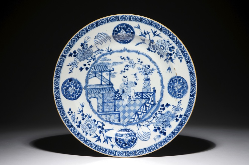 A large Chinese blue and white dish with a boy on a terrace, Qianlong