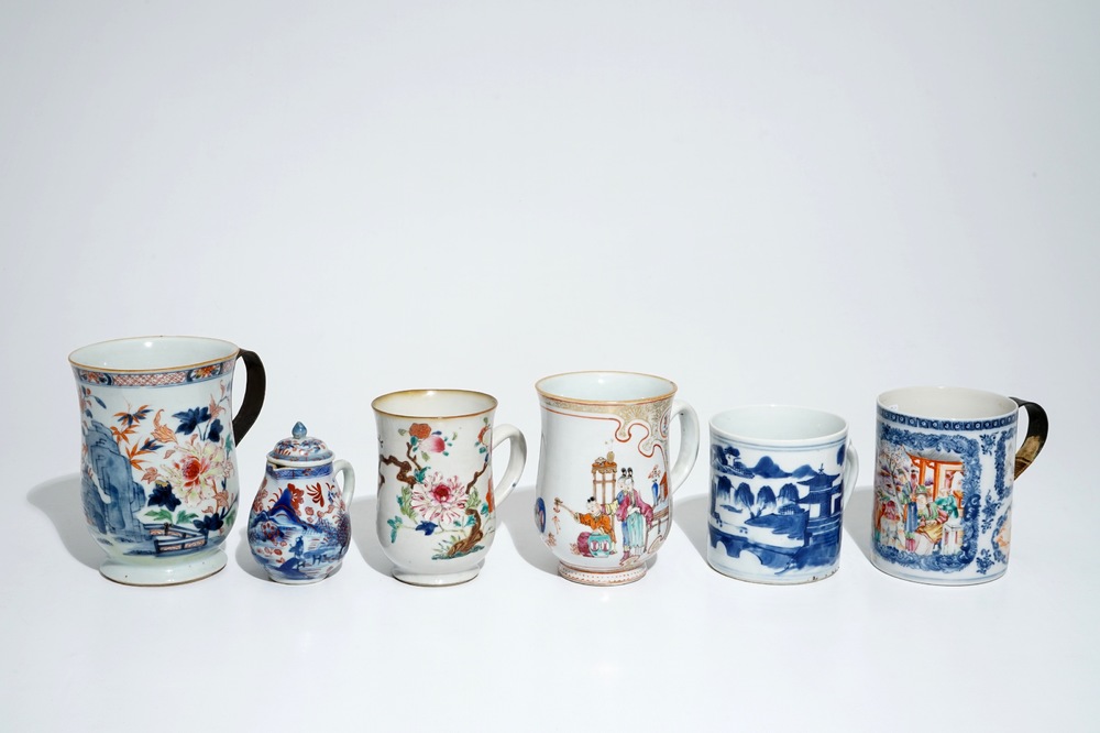 Five Chinese famille rose and blue and white mugs and a covered jug, mostly Qianlong