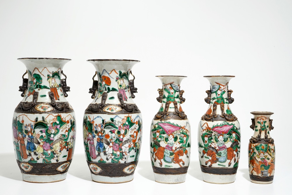 Two pairs of Chinese Nanking famille rose vases and a smaller one, 19/20th C.