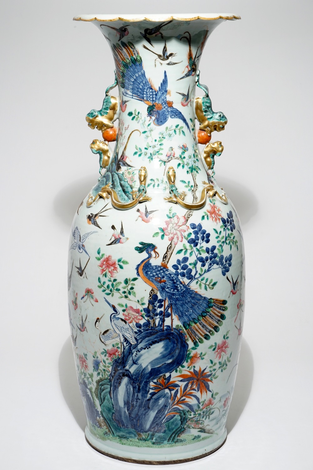 A very large Chinese famille rose vase with a peacock, 19th C.