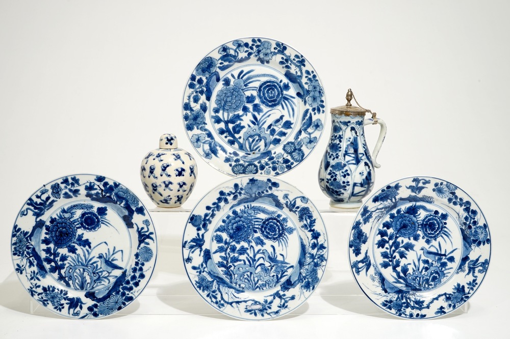 Four Chinese blue and white plates, a silver-mounted jug and a small covered jar, Kangxi