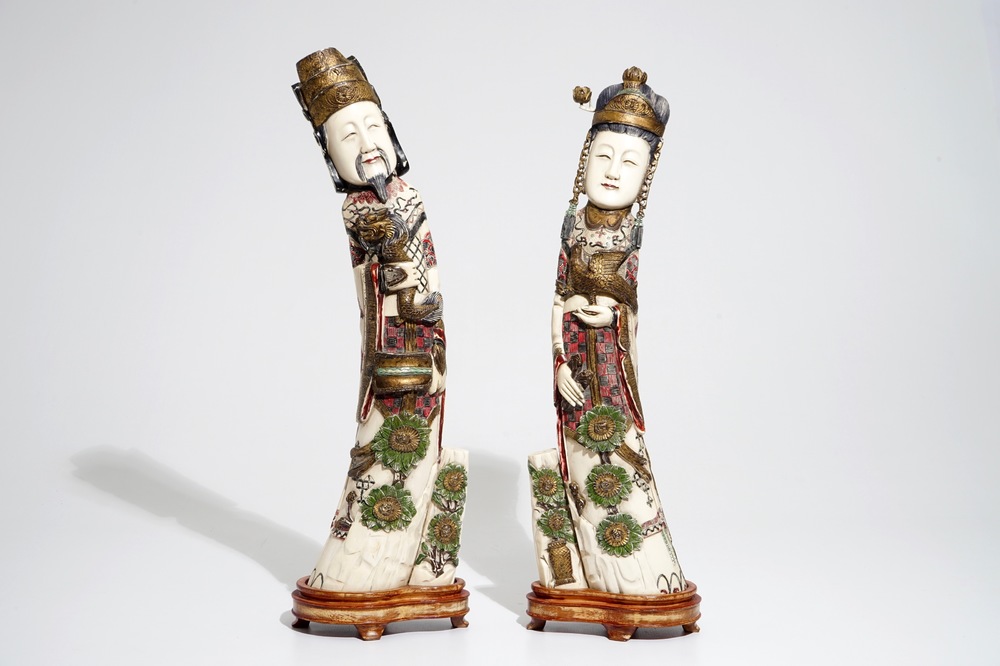 A pair of tall Chinese polychrome ivory figures, early 20th C.