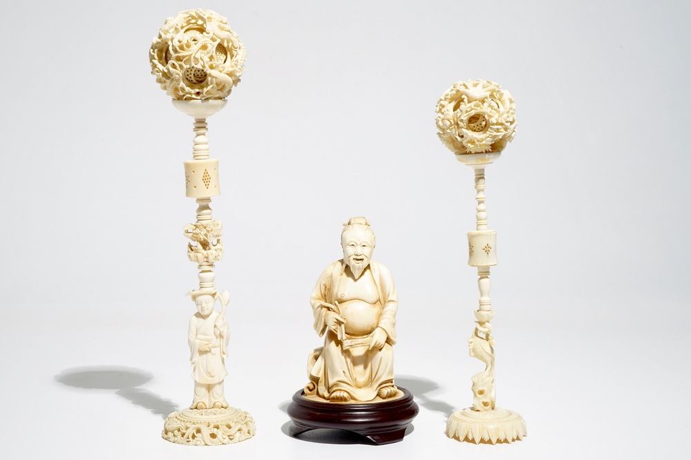 Two Chinese Canton ivory puzzle balls on stands and a figure of a sage, 19th C.