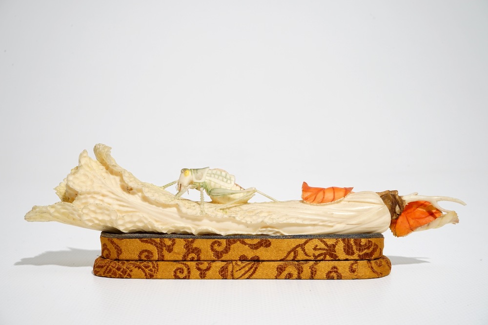 A Chinese polychrome ivory group of a cricket on cabbage, early 20th C.