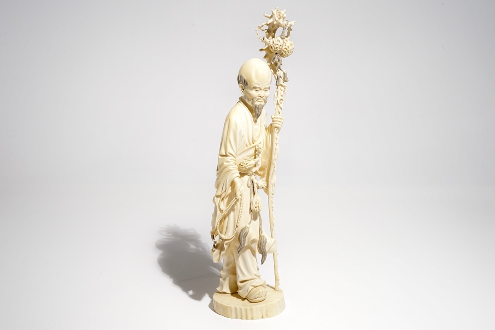 A tall Chinese ivory model of an immortal, late 19th C.