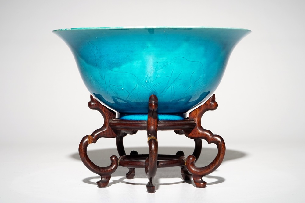 A Chinese monochrome turquoise bowl with incised design of horses, Kangxi mark, 19/20th C.