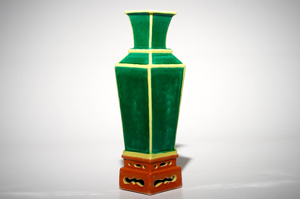 A tapered square Chinese vase on stand in green, yellow and orange, 19/20th C.