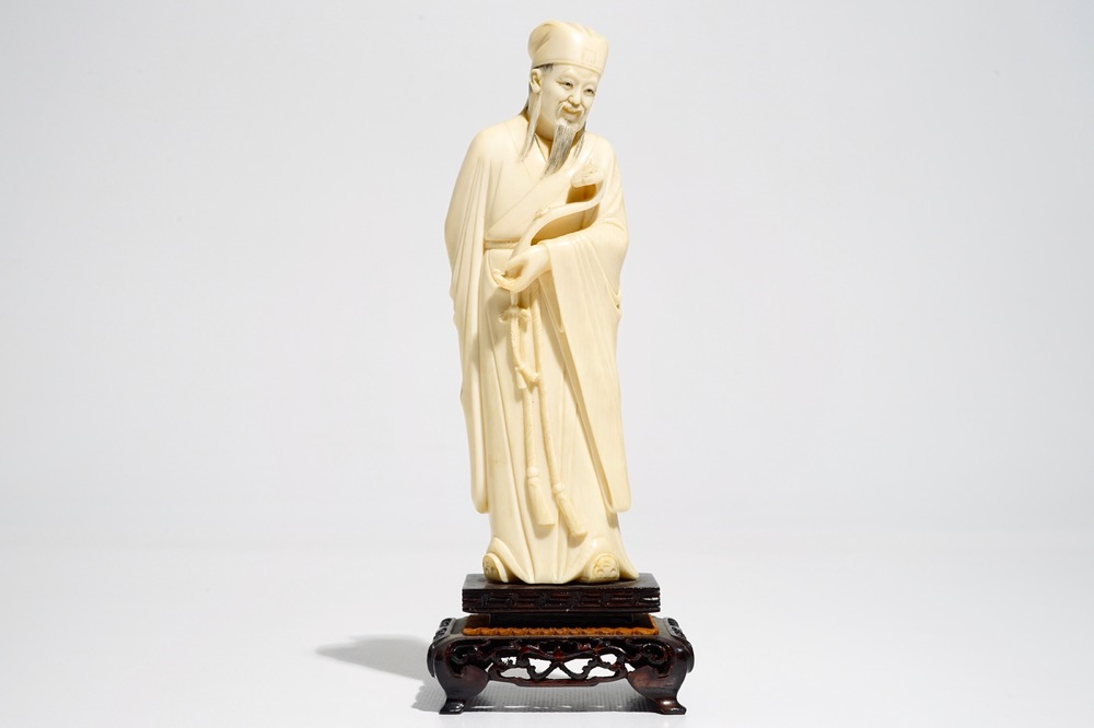 A Chinese ivory figure of a scholar, 19th C.