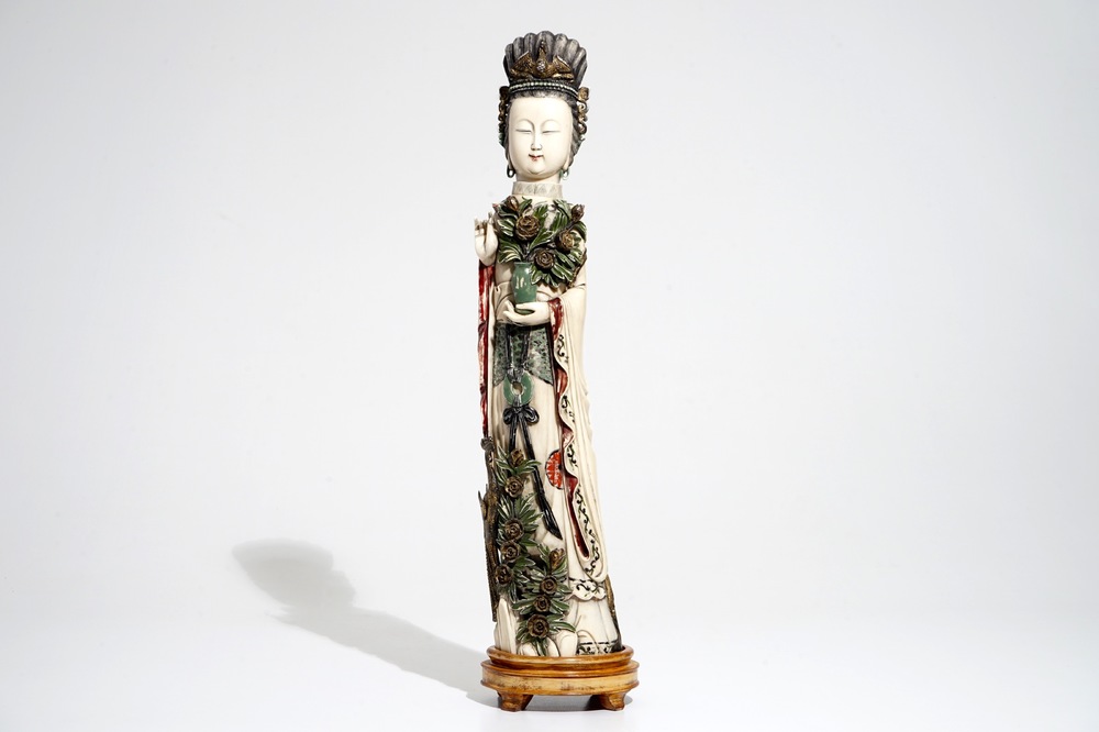 A tall Chinese polychrome ivory model of a lady with removable head, 19th C.