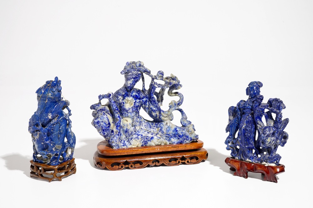 Three Chinese lapis lazuli sculptures on wooden stands, 20th C.