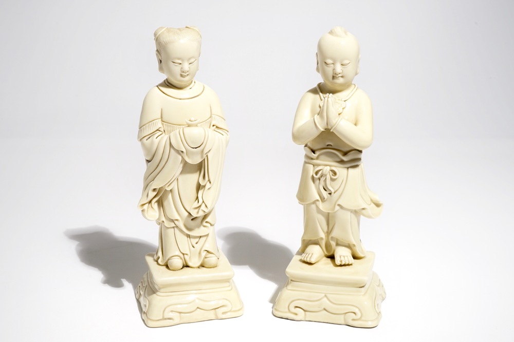 A pair of Chinese blanc de Chine models of a boy and a girl, 20th C.