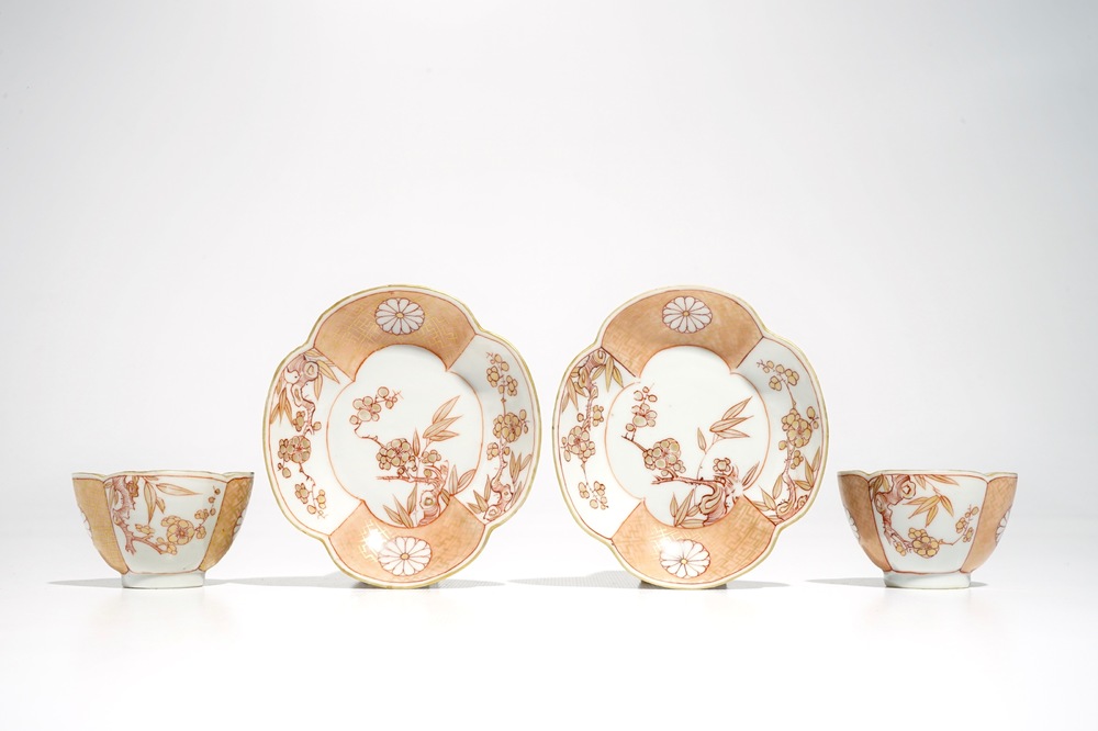 A pair of Chinese milk and blood quatrefoil cups and saucers, Kangxi