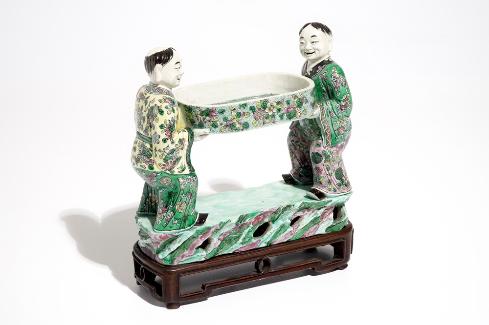 A Chinese verte biscuit group of the Hehe Er Xian brothers holding a tray, 19th C.