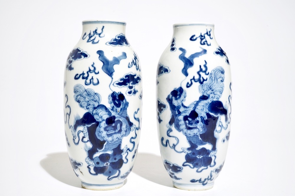 A pair of Chinese blue and white vases with Buddhist lions, Kangxi mark, 19th C.
