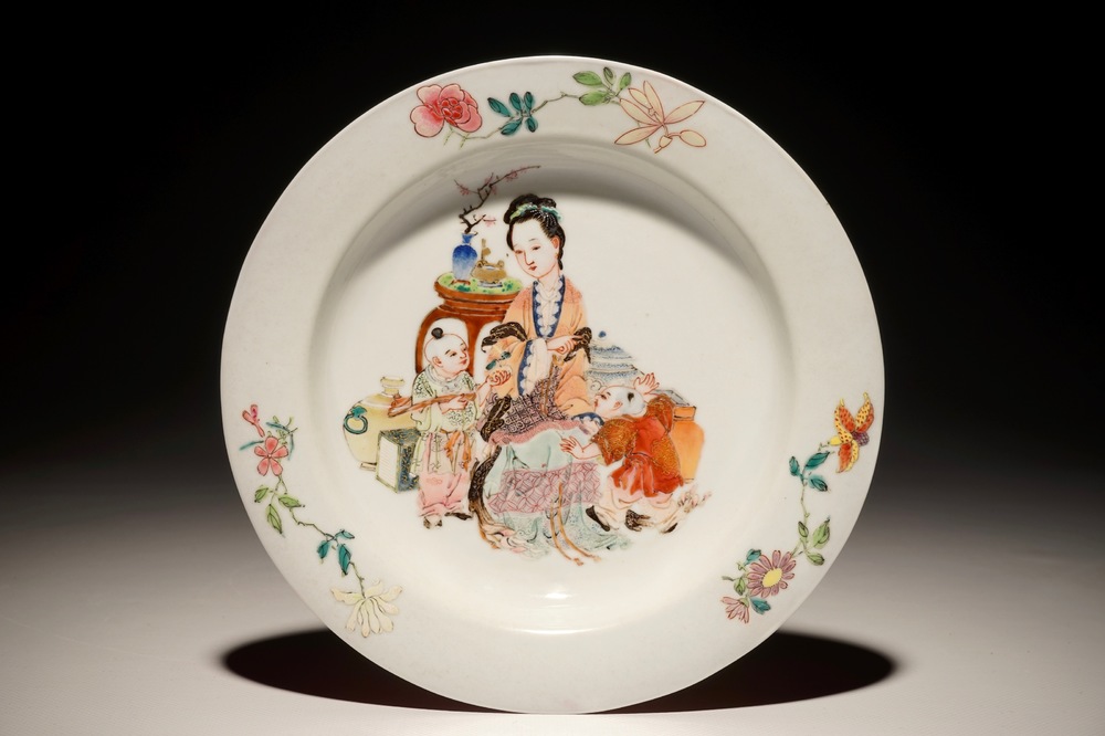 A Chinese famille rose ruby back eggshell plate with a lady and playing boys, Yongzheng