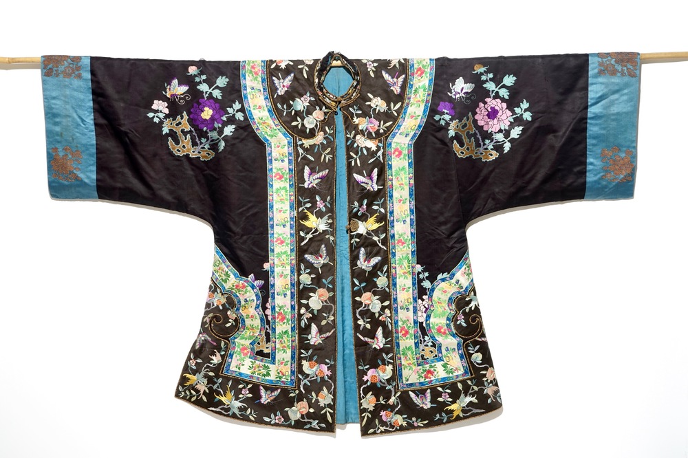 A Chinese embroidered silk woman's robe with butterflies and fruits, Qing