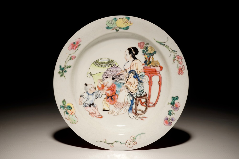 A Chinese famille rose ruby back eggshell plate with a lady and playing boys, Yongzheng