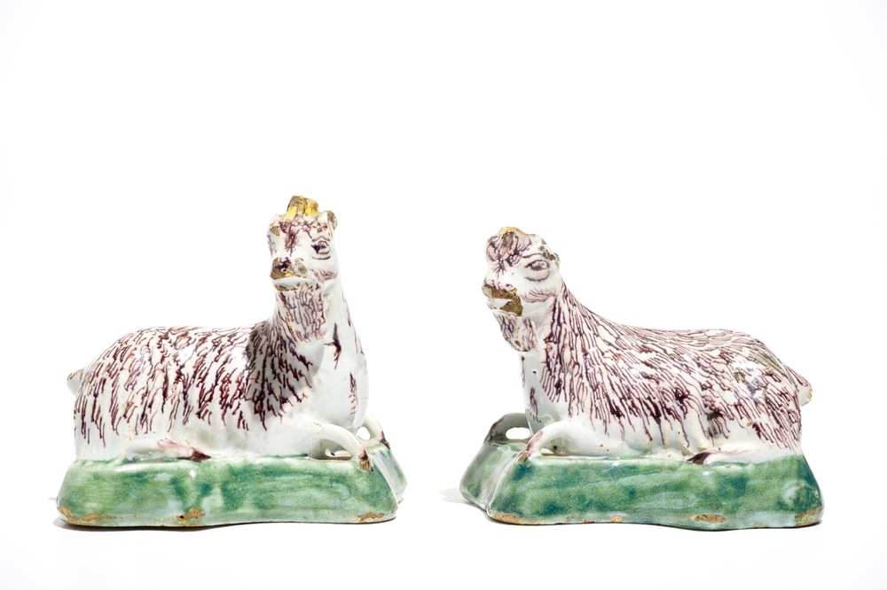 A pair of Dutch Delft polychrome models of goats on a ground, 18th C.