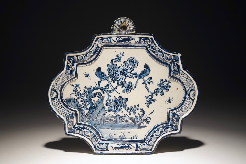 A Dutch Delft blue and white plaque with birds among flowers, 18th C.