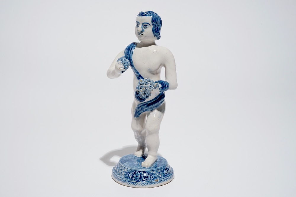 A Dutch Delft blue and white model of Bacchus, early 18th C.