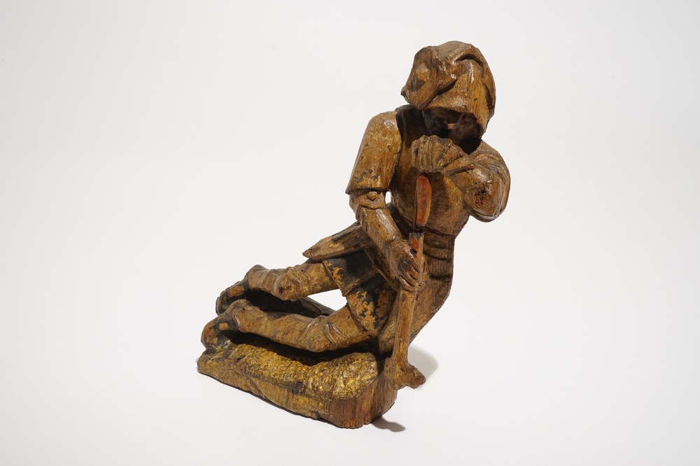 A seated soldier, retable fragment, oak with polychromy, Flanders, 16th C.